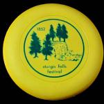 MODEL -  Colt and Dumont Discus
COLOR - Yellow
WEIGHT - Unknown
CONDITION - New
COMMENT - Example of a free disc advertising and event and used by recreational players to play Frisbee Golf.
